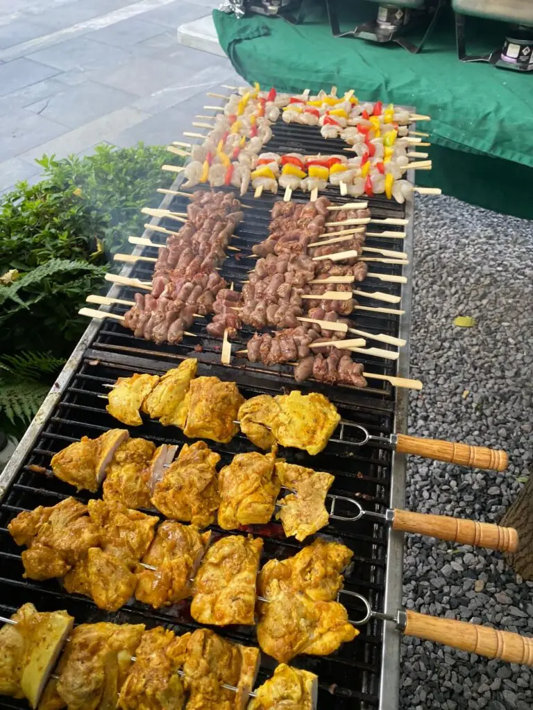 Skewers sizzling over hot coals